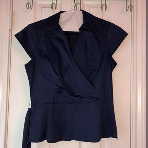 Blue collared blouse with a belt